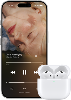 iPhone next to AirPods in charging case, case is open