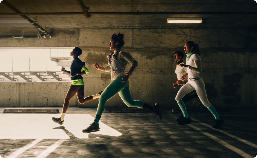 A group of people running in a city while wearing Apple Watch Series 12