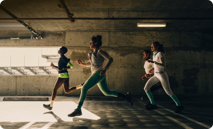 A group of people running in a city while wearing Apple Watch Series 12
