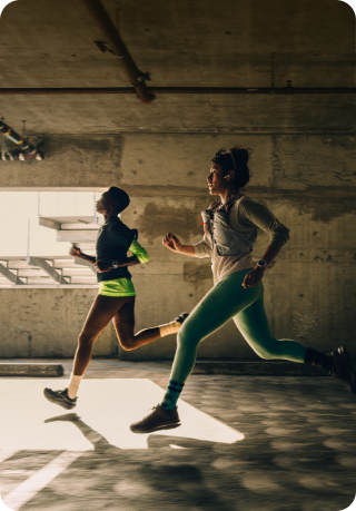 A group of people running in a city while wearing Apple Watch Series 12