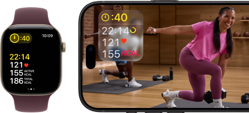 Apple Watch next to iPhone with Apple Fitness+ class on screen