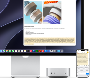 Mac mini front, tucked under Studio Display, an iPhone sits to the right of the device and the display, text selected with cut, copy, paste and AutoFill commands above on iPhone matches highlighted text on display, showcasing Universal Clipboard