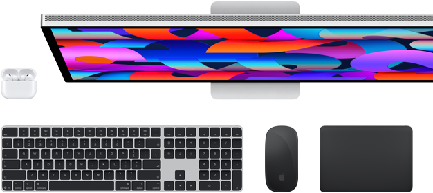 Collection of accessories and device including AirPods, Magic Keyboard with Touch ID, Magic Mouse, Magic Trackpad, Studio Display