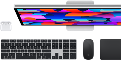 Collection of accessories and device including AirPods, Magic Keyboard with Touch ID, Magic Mouse, Magic Trackpad, Studio Display