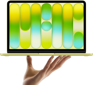 MacBook Neo in citrus colour, balanced on fingertips of open hand, screen displaying colourful abstract pattern