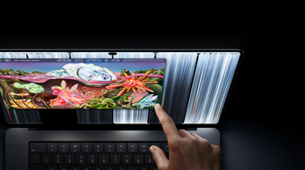 MacBook Pro with PROLED XDR Display, space black colour, user resizes a window on screen with their fingertip