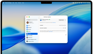 MacBook Pro 16-inch M4 screen shows a scheduled Software Update within System Settings