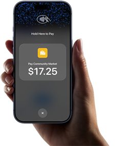 Right hand holding iPhone with display showing specific amount to be paid and instructions on how to contactlessly pay when ready