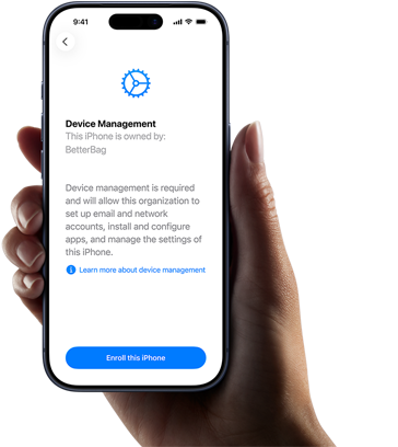 Right hand holding iPhone with screen displaying copy explaining what Device Management is with option to enrol