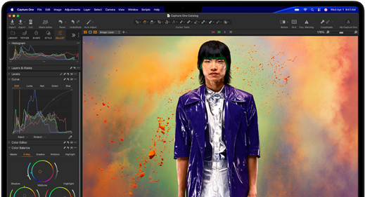 MacBook Pro screen showing a photo of a person being edited in Capture One